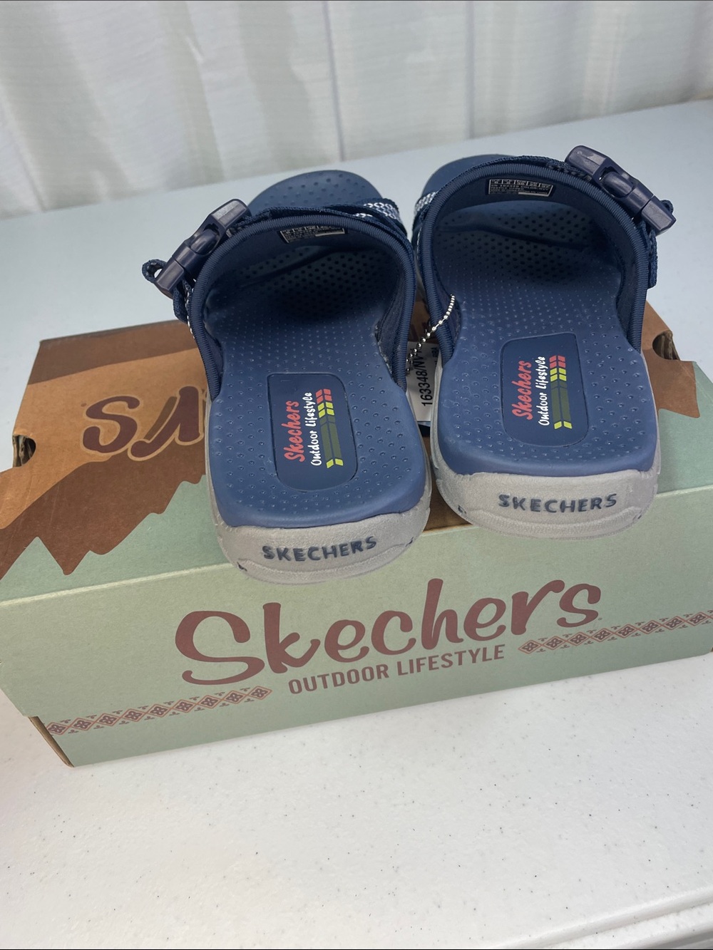 Skechers women’s Navy and White Slip-On Sport Sandals - Picture 4 of 9